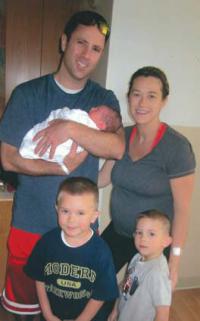 Cellucci Family: In a photo taken before the accident, Kevin Cellucci is shown holding his newborn son Paul, with wife Tina, and boys Stephen, 4, and Declan, 3. Photo courtesy The Kevin Cellucci Foundation